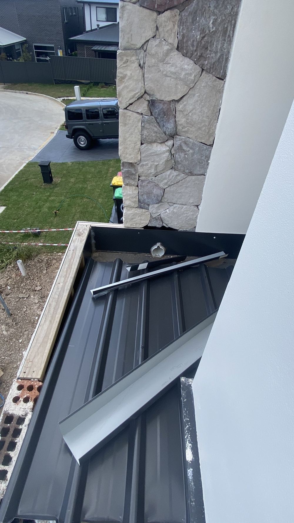 Box gutter installed with no sump to gather and discharge the water, found during a defect investigation in Tallawong