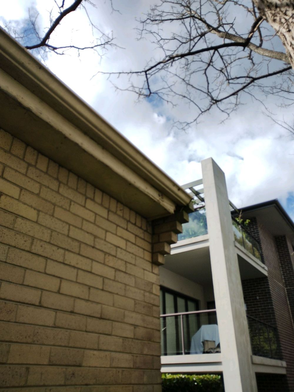 Damaged gutter and fascia letting water soak the ground at the footings, found during a defect investigation in Forestville