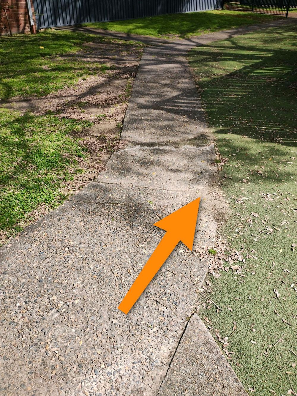 Major cracking through outdoor concrete, pointing to thin pavement or light steel, found during a defect investigation in Forestville