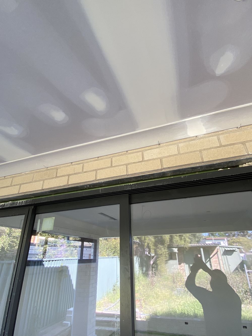 Gaps around a door head too wide to leave without infill, found during a fixing stage inspection in Kellyville