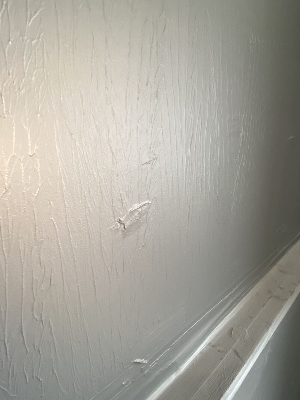 Membrane rolled on unevenly, with bulges across the ensuite shower floor, found during a fixing stage inspection in Kellyville