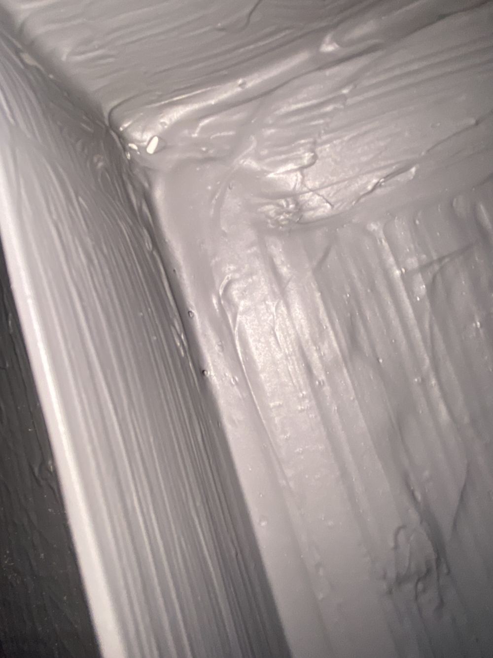 Pinholes through a shower membrane that must be sealed before tiling, found during a fixing stage inspection in Kellyville