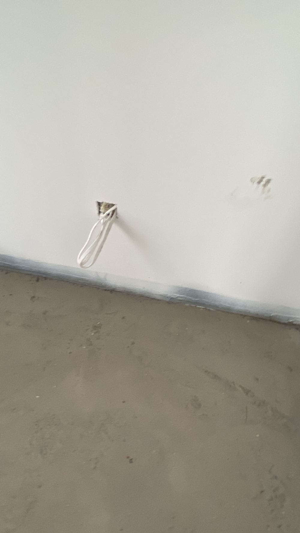 Paint brushed over a wet area membrane, which the standard does not allow, found during a defect investigation in Tallawong