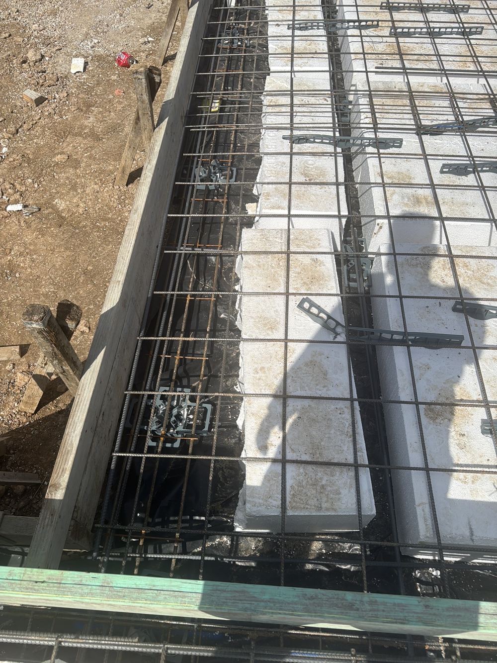 Steel sitting too close to the edge form to get its full concrete cover, found during a slab inspection in Tallawong