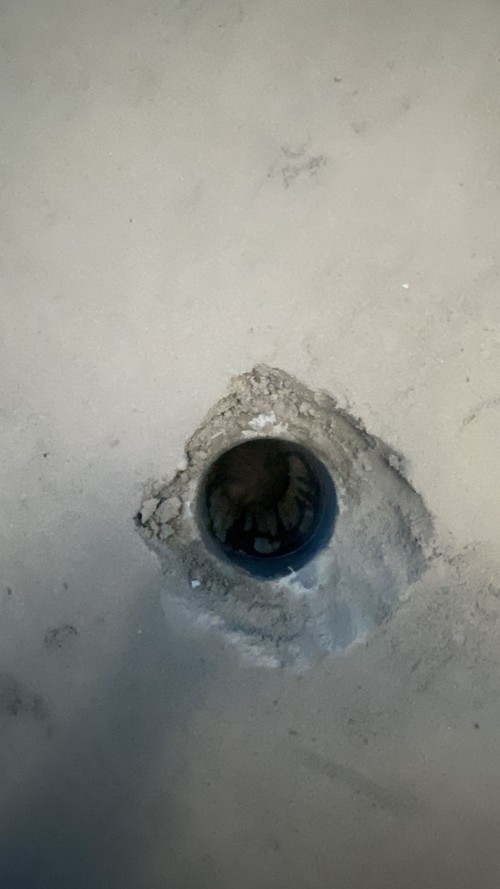 Wet area floor waste with no puddle flange tying it into the membrane, found during a defect investigation in Tallawong