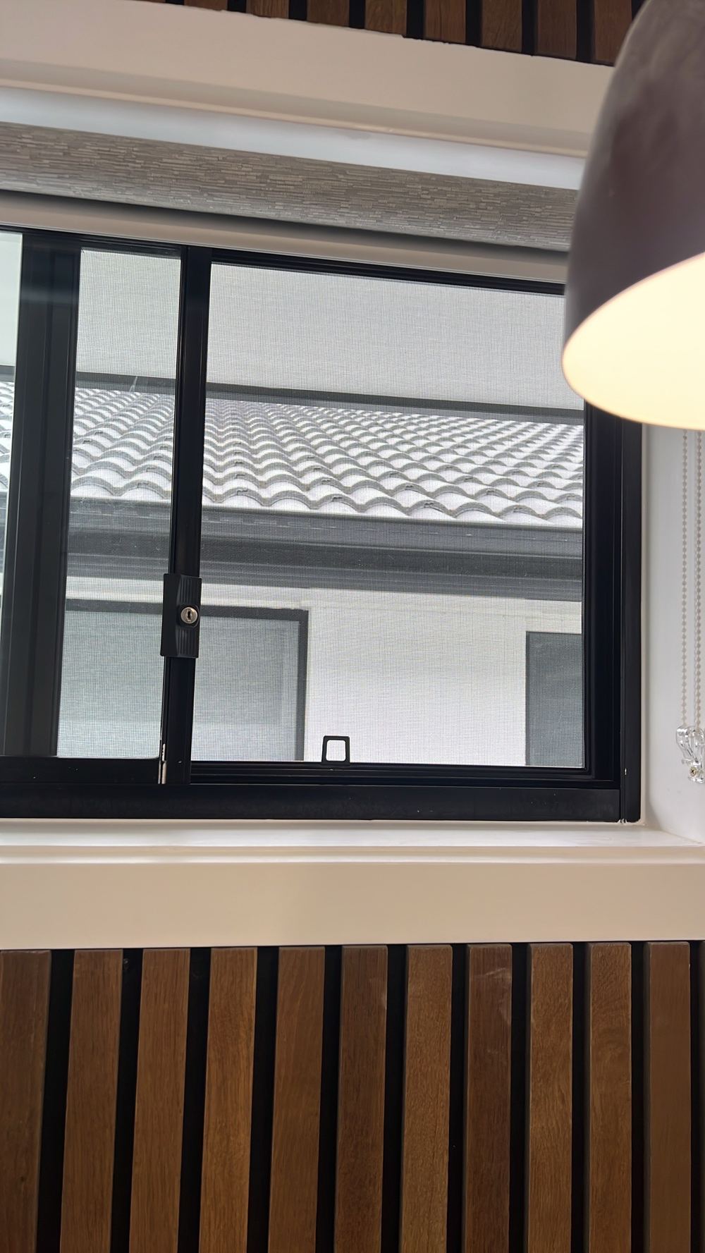 Upstairs bedroom window missing its 125mm opening limit for child safety, found during a handover inspection in Tallawong